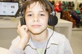 Portrait of a sweet young boy listening to music Royalty Free Stock Photo