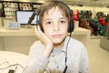 Portrait of a sweet young boy listening to music on headphones Royalty Free Stock Photo