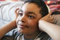 A Portrait of a sweet young boy listening to music on headphones Royalty Free Stock Photo