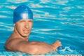 Portrait of a swimmer at the edge of a swimming pool