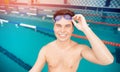 Portrait swimmer happy young man, background swimming pool blue water Royalty Free Stock Photo