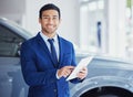 Portrait, tablet and car salesman smile at dealership, workshop or workplace. Face, technology and male person at