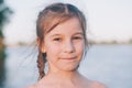 portrait of tanned Portrait of a tanned little girl in a sundress by the sea Royalty Free Stock Photo