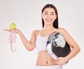 Portrait, tape measure or girl with apple or scale for healthy snack, nutrition diet or digestion benefits. Happy woman