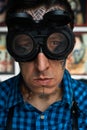 Portrait of tattoo master in welder glasses