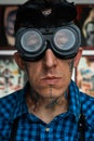 Portrait of tattooist in welder glasses