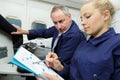 Portrait teacher and female aero engineer with clipboard Royalty Free Stock Photo