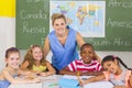 Portrait of teacher and kids in classroom