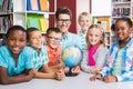Portrait of teacher and kids with globle Royalty Free Stock Photo