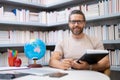 Portrait of teacher in library classroom. Handsome teacher in university library. Teachers Day. Teacher giving classes Royalty Free Stock Photo