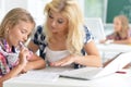 Teacher with two schoolgirls Royalty Free Stock Photo