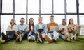 Portrait of team in creative workspace for startup business, working on laptop. Technology, teamwork and diversity in Royalty Free Stock Photo