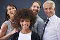 Portrait, team and happy business people in studio isolated on a blue background. Face, smile and group of diverse Royalty Free Stock Photo