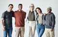 Portrait of a Team of happy united young business people hugging each other. Diverse mixed race group of men and women