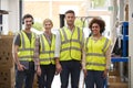 Portrait Of Team Wearing Headsets In Logistics Distribution Warehouse Royalty Free Stock Photo