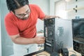 Portrait of technician install a new hardware a part of personal computer Royalty Free Stock Photo