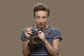 Portrait of teen boy with vintage photo camera. Royalty Free Stock Photo