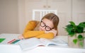 Portrait Of Teen Girl Sleeping At Desk, Tired After Doing School Homework Royalty Free Stock Photo