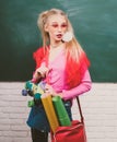 Portrait of a teen female student, charming teenager younf school girl with wearing funny eyeglasses and backpack. Royalty Free Stock Photo