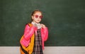 Portrait of a teen female student. Funny school girl wearing eyeglasses, child studio portrait. Education concept. Young