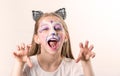 Portrait of teen girl with cat face painting Royalty Free Stock Photo