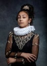 Portrait of a teen girl with dark curly hair, wearing a ruffled collar