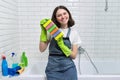 Portrait of teen girl doing cleaning in bathroom Royalty Free Stock Photo