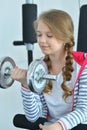 Portrait of teen girl exercising with dumbbell Royalty Free Stock Photo