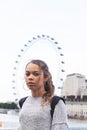 Portrait of teen girl with London Eye background