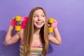 Portrait of teen girl with long hair wear colorful singlet hold skateboard on shoulders look empty space isolated on Royalty Free Stock Photo