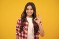 Portrait of teen girl making ok gesture,  background. Young teenager smiling and giving okey sign. Happy cute Royalty Free Stock Photo