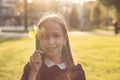 Portrait of teen girl with maple leaf