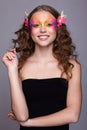 Portrait of teen girl with orchid flower in wavy hair Royalty Free Stock Photo