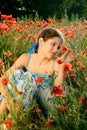 Portrait teen girl with poppy Royalty Free Stock Photo