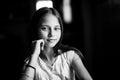 Portrait of teen girl sitting at the table. Black and white photo. Royalty Free Stock Photo