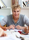 Portrait of a teen guy studying in the library Royalty Free Stock Photo