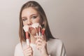 Portrait of teen model with stylish makeup holding contour brush