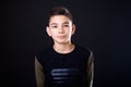 Portrait teenage boy on a black background. Royalty Free Stock Photo