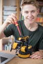 Portrait Of Teenage Boy Building Robotic Arm At School Royalty Free Stock Photo