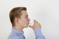 Teenage boy drinking water out of a glass Royalty Free Stock Photo