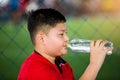 Portrait of teenage boy drinking water Royalty Free Stock Photo