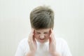 Portrait of teenage boy with a headache Royalty Free Stock Photo