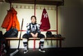 Boy preparing for ice hockey game in locker room