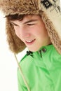 Portrait Of Teenage Boy In Snow Wearing Fur Hat Royalty Free Stock Photo