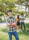 Portrait of Teenage Boy Wearing Headphones And Listening To Music with friends. Royalty Free Stock Photo