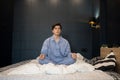 Boy Meditating on Bed Royalty Free Stock Photo