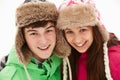 Portrait Of Teenage Couple In Snow