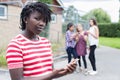 Portrait Of Teenage Girl Being Bullied By Text Message Royalty Free Stock Photo