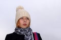 Portrait of teenage girl with blond hair in a knitted hat Royalty Free Stock Photo