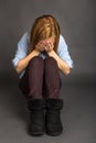 Portrait of teenage girl covering her face with hands Royalty Free Stock Photo